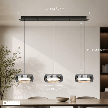 Glass drum pendant light hanging above a kitchen island