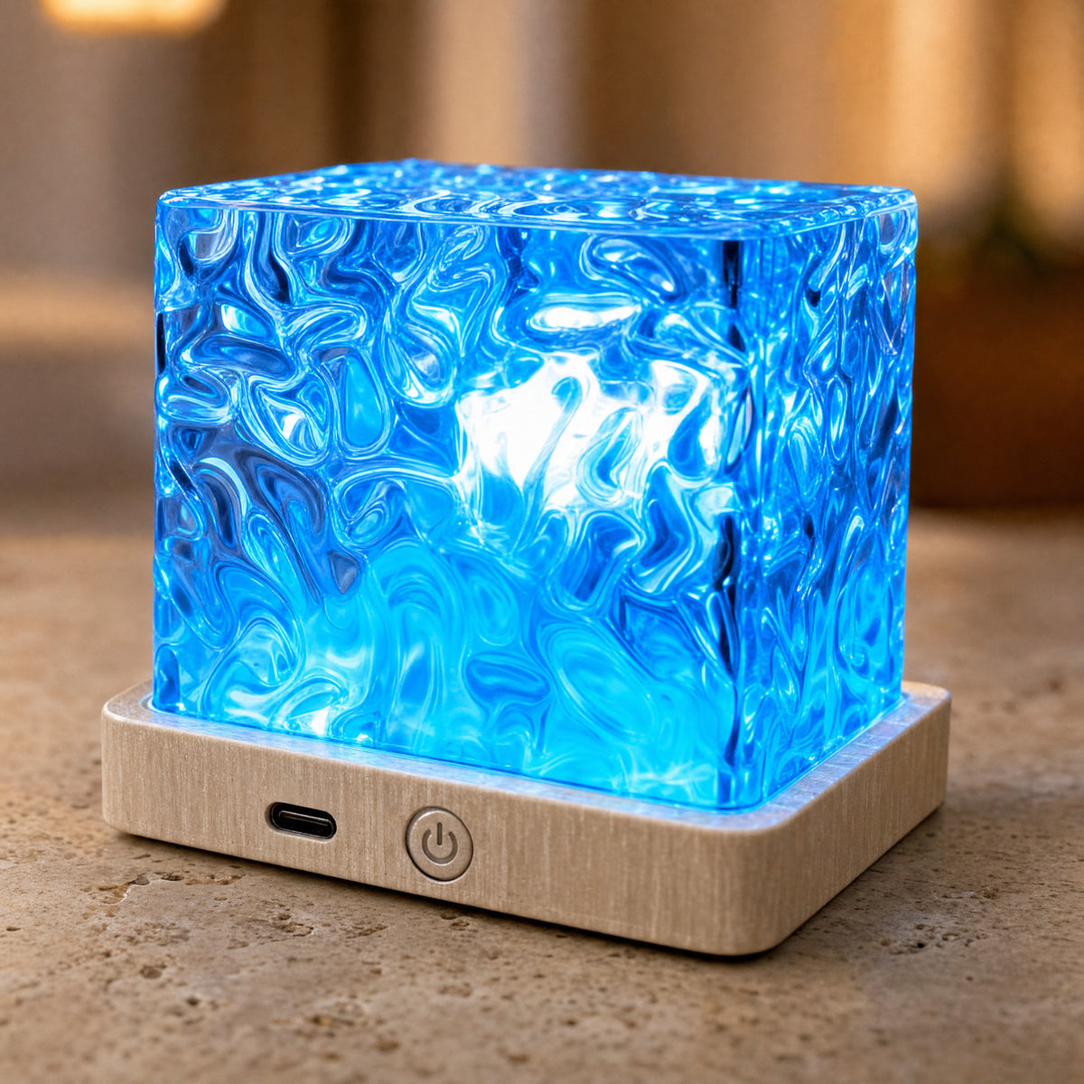 Close-up of the lamp's pale wood base showing the USB-C charging port and touch power button