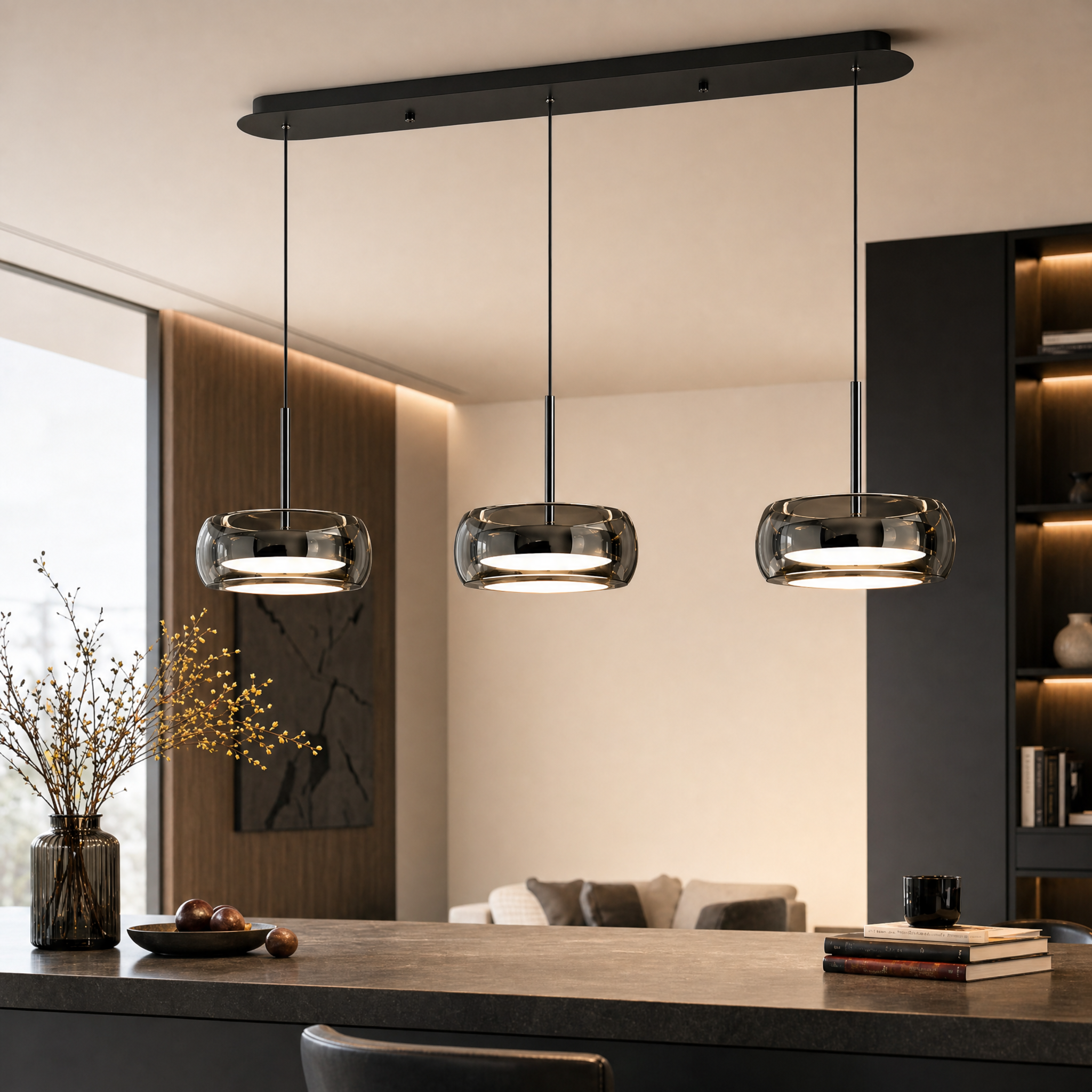 Single-head glass drum pendant light above a bedside table
