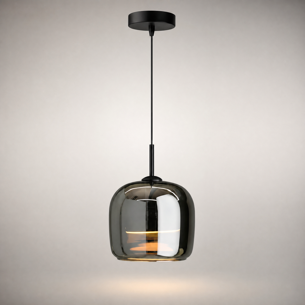 Moon glass pendant light glowing warm white above a dining table