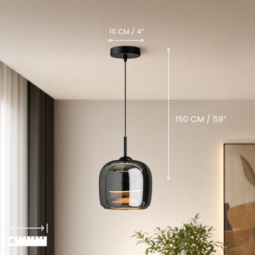 Single-head moon glass pendant light above a bedside table