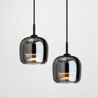 Three-head moon glass pendant light cluster over a dining table