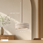 Travertine pendant light glowing warm in a cozy living room