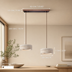 Travertine stone pendant light above a dining table at night
