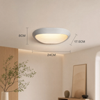 Black geometric wall sconce with warm white LED light