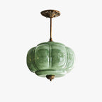 Elegant Green Glass Pendant Lighting with Antique Brass Accents for Stylish Kitchen Illumination