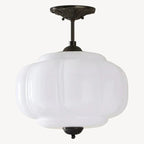 Elegant Green Glass Pendant Lighting with Antique Brass Accents for Stylish Kitchen Illumination