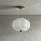 Elegant Green Glass Pendant Lighting with Antique Brass Accents for Stylish Kitchen Illumination