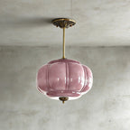 Elegant Green Glass Pendant Lighting with Antique Brass Accents for Stylish Kitchen Illumination