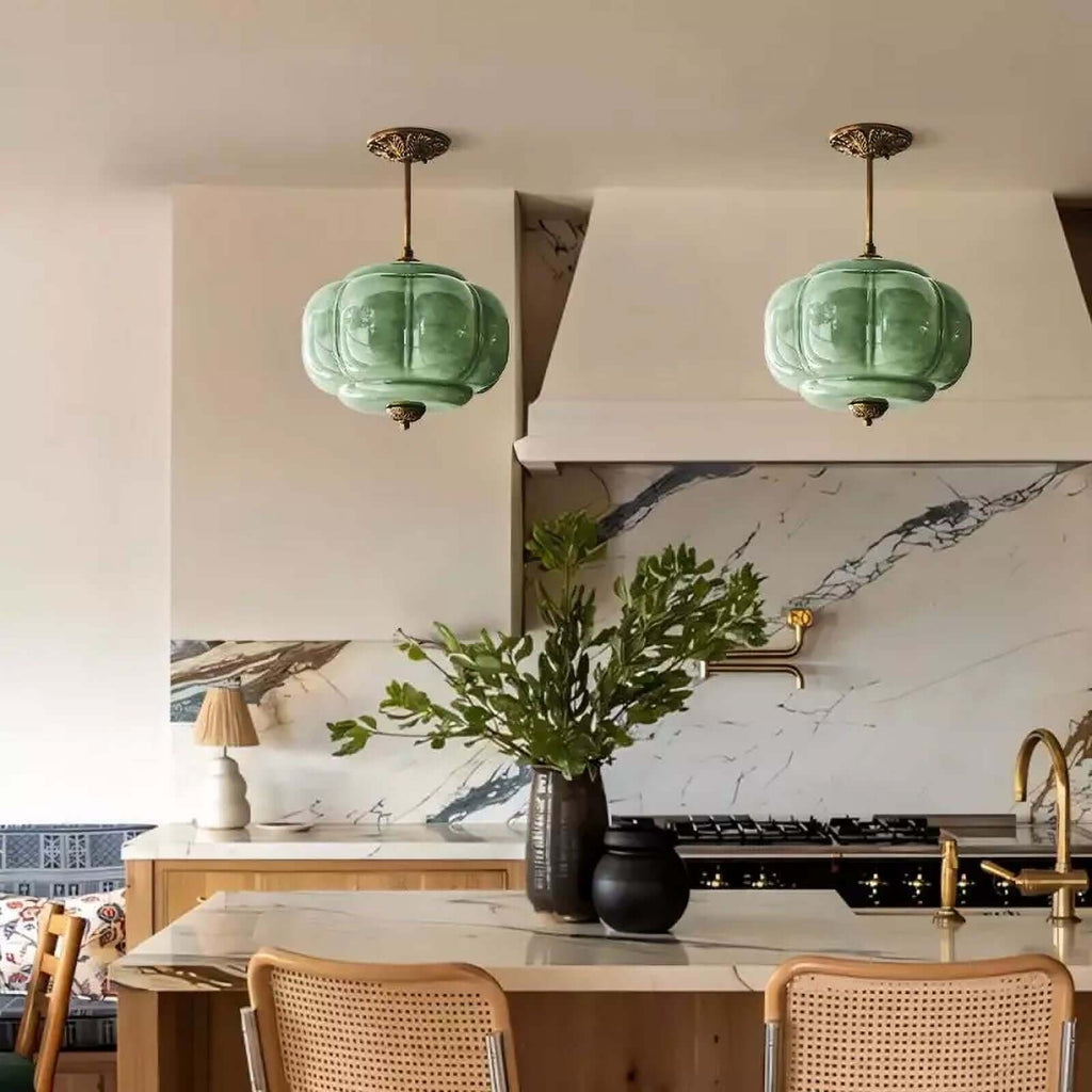 Elegant Green Glass Pendant Lighting with Antique Brass Accents for Stylish Kitchen Illumination