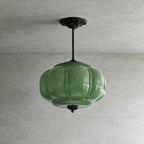 Elegant Green Glass Pendant Lighting with Antique Brass Accents for Stylish Kitchen Illumination