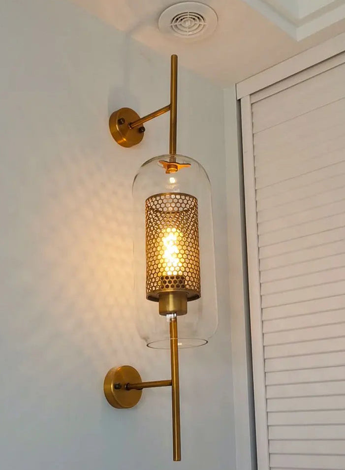 Modern Brass Wall Sconce with Honeycomb Glass Shade | Elegant Wall Lighting for Ambient Indoor Spaces