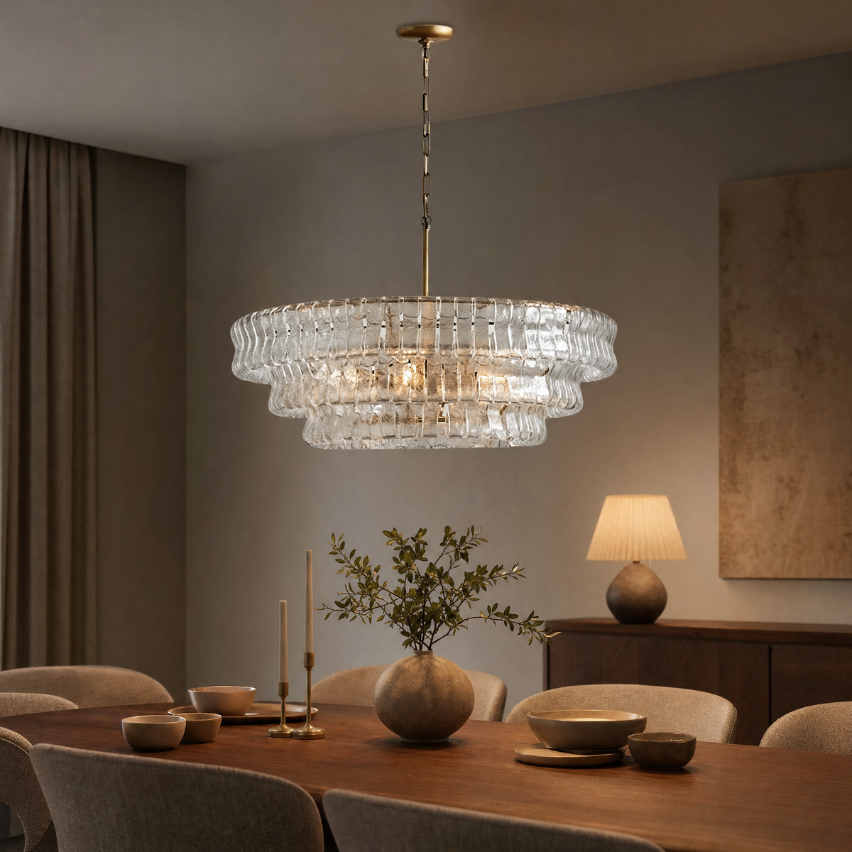 Ghiaccio ribbed glass round chandelier glowing above a walnut dining table in a modern dining room