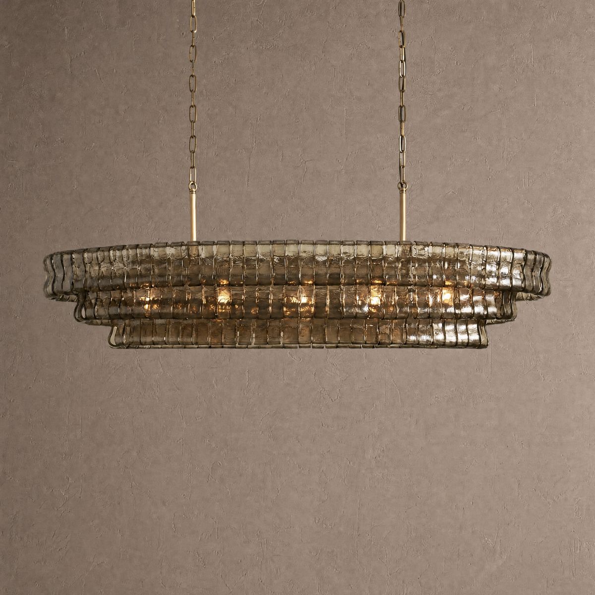 Ghiaccio oval chandelier in smoke gray ribbed hand-blown glass with twin brass chains