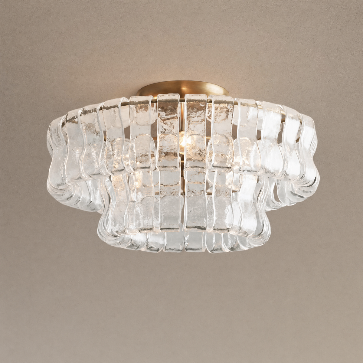 Ghiaccio flushmount ceiling light in clear ribbed hand-blown glass on an antique brass base