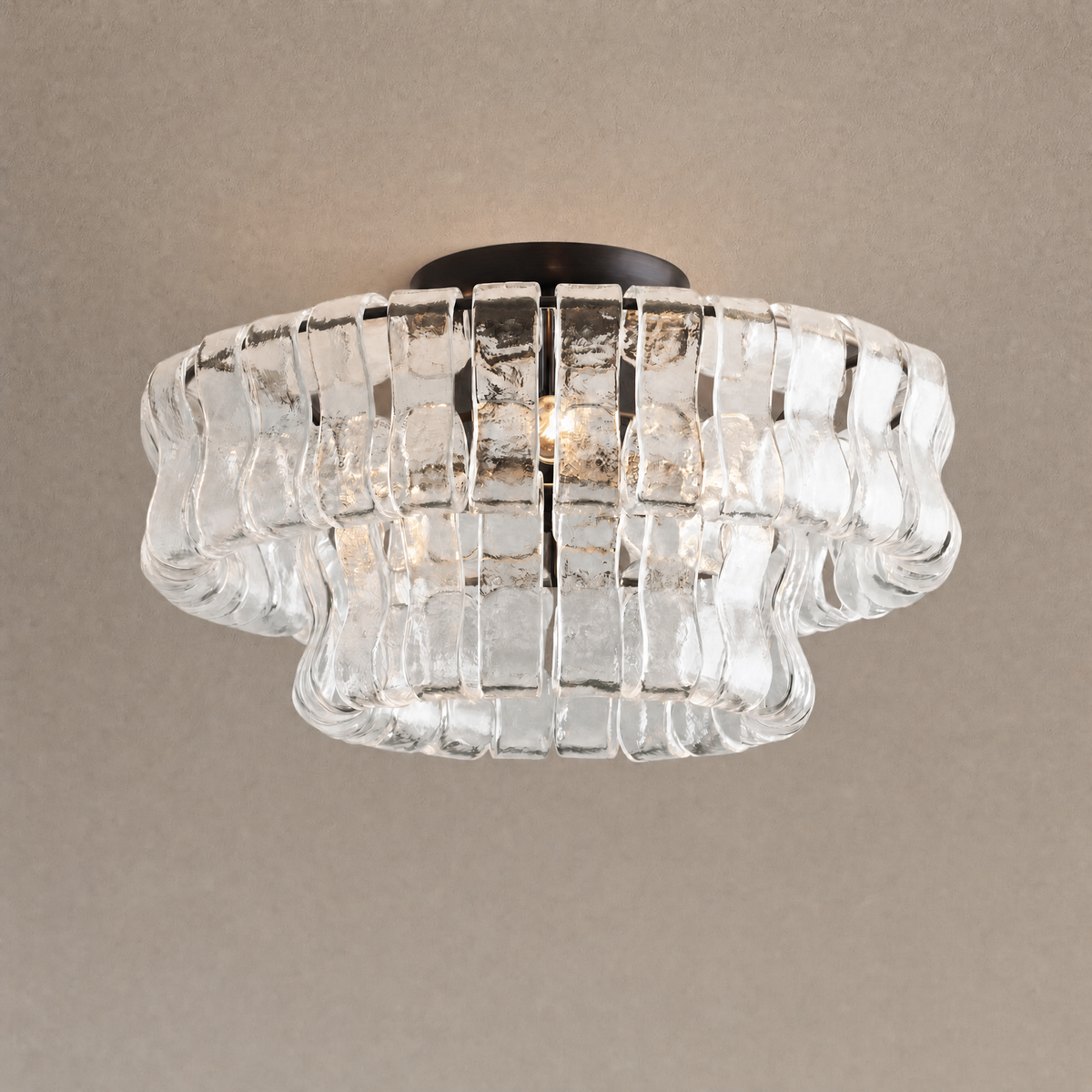 Ghiaccio flushmount in clear ribbed glass on a dark bronze ceiling base