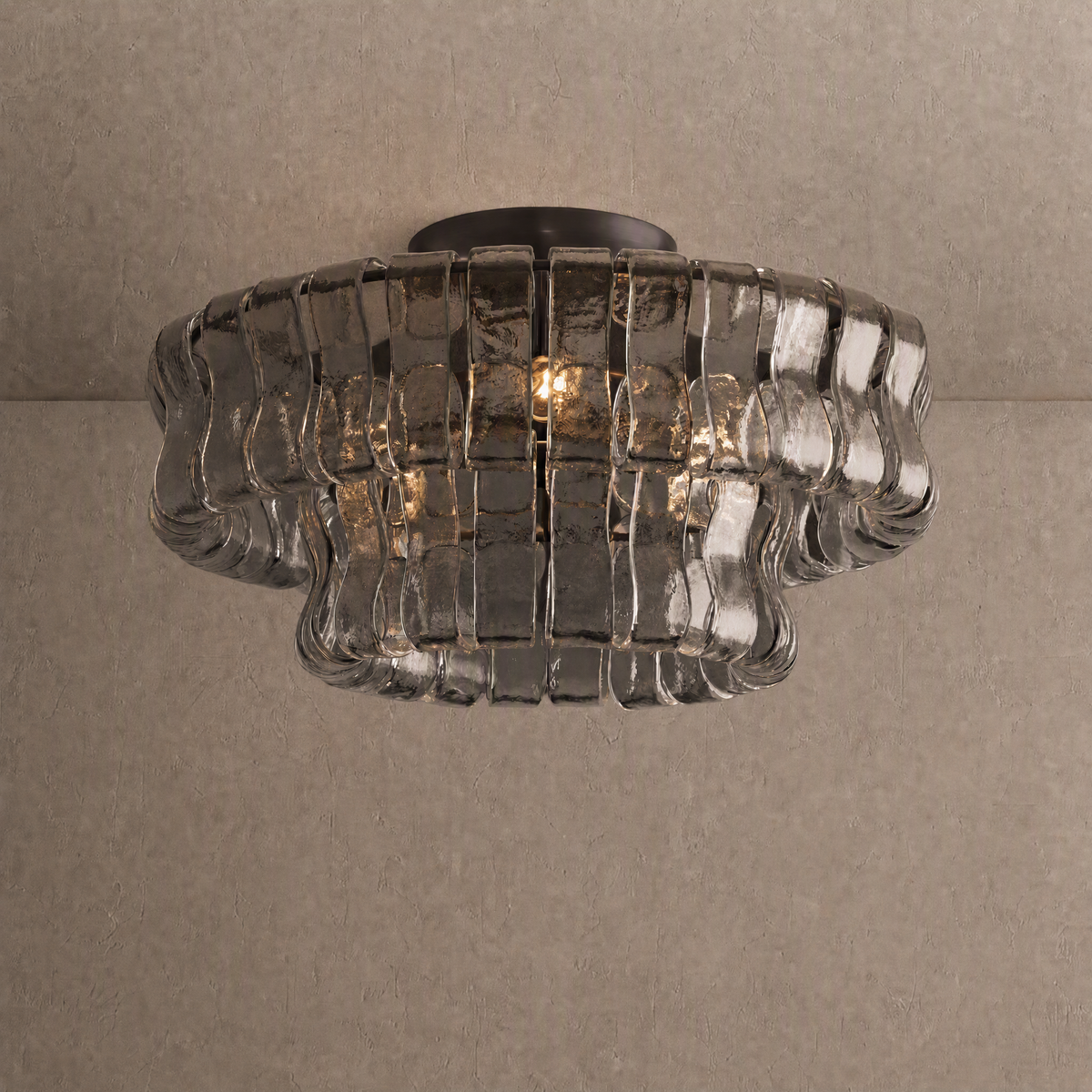 Ghiaccio flushmount in smoke gray ribbed glass on a dark bronze ceiling base
