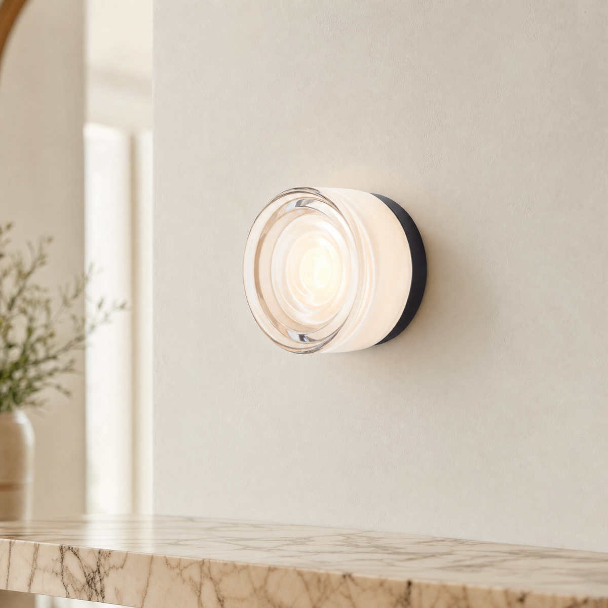 Vela modular wall sconce in White Wave above a marble shelf in an upscale interior