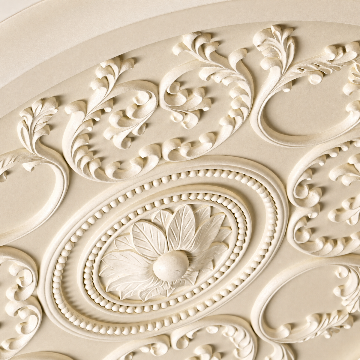 Close-up of the carved baroque relief on the ceiling light