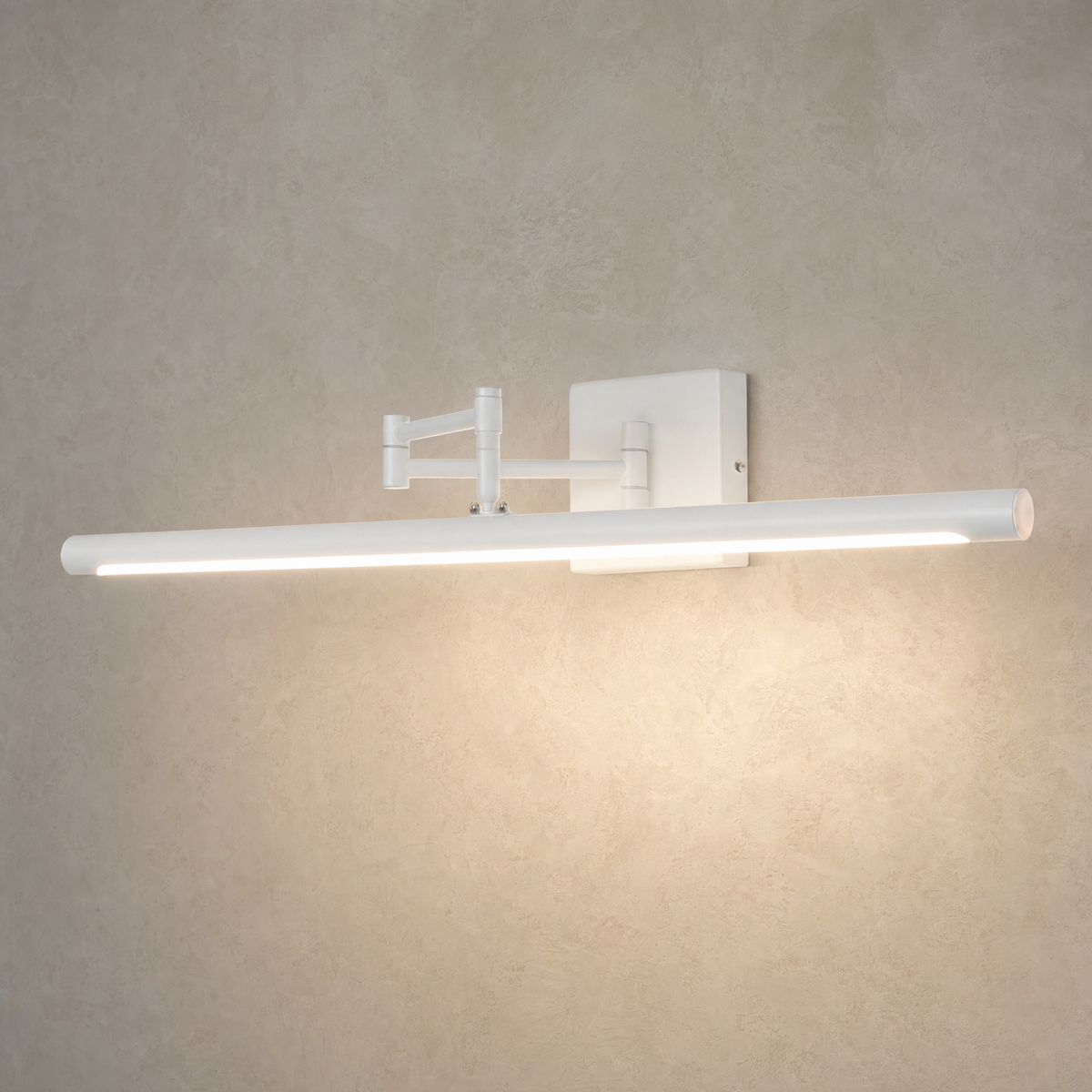 White swing arm LED vanity light switched on, casting a warm glow
